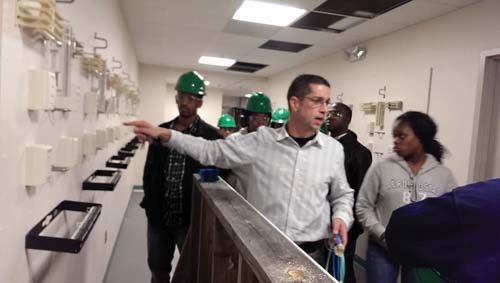 Building Pathways: Students learn about fiber optics at IBEW Local 103. Photo by Gintautas Dumcius